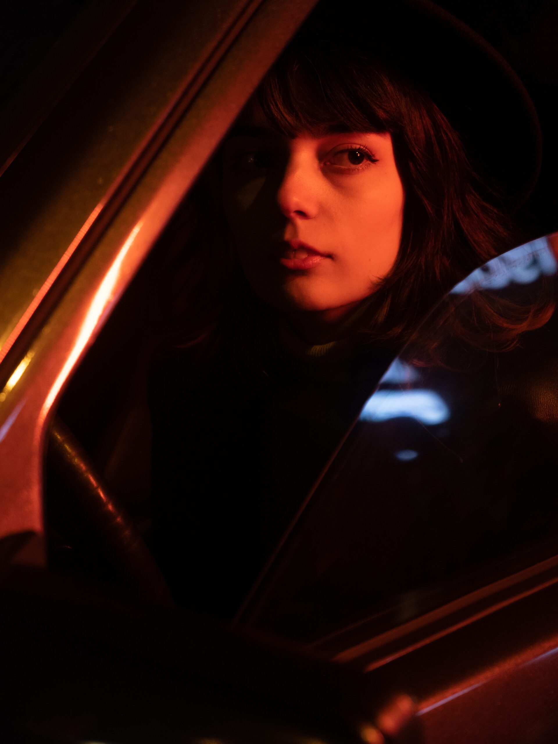 Portrait of a woman sitting in a car